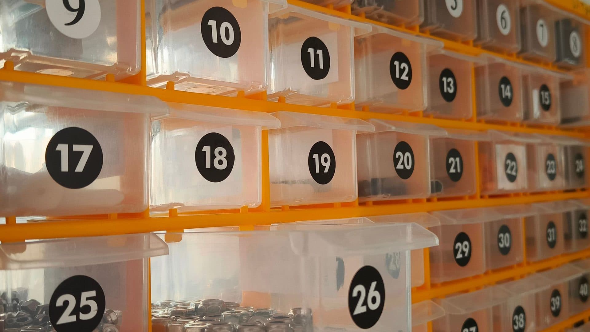 Numbered bins holding components, ready to be picked into kits